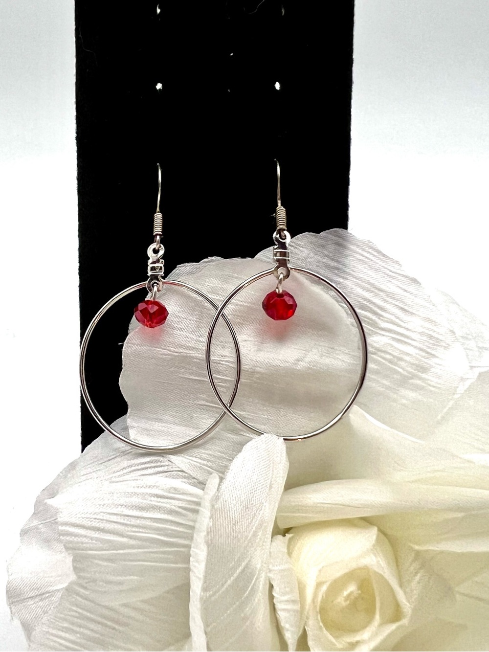 Elegant Silver Hoop Earrings with Red Crystal Accent